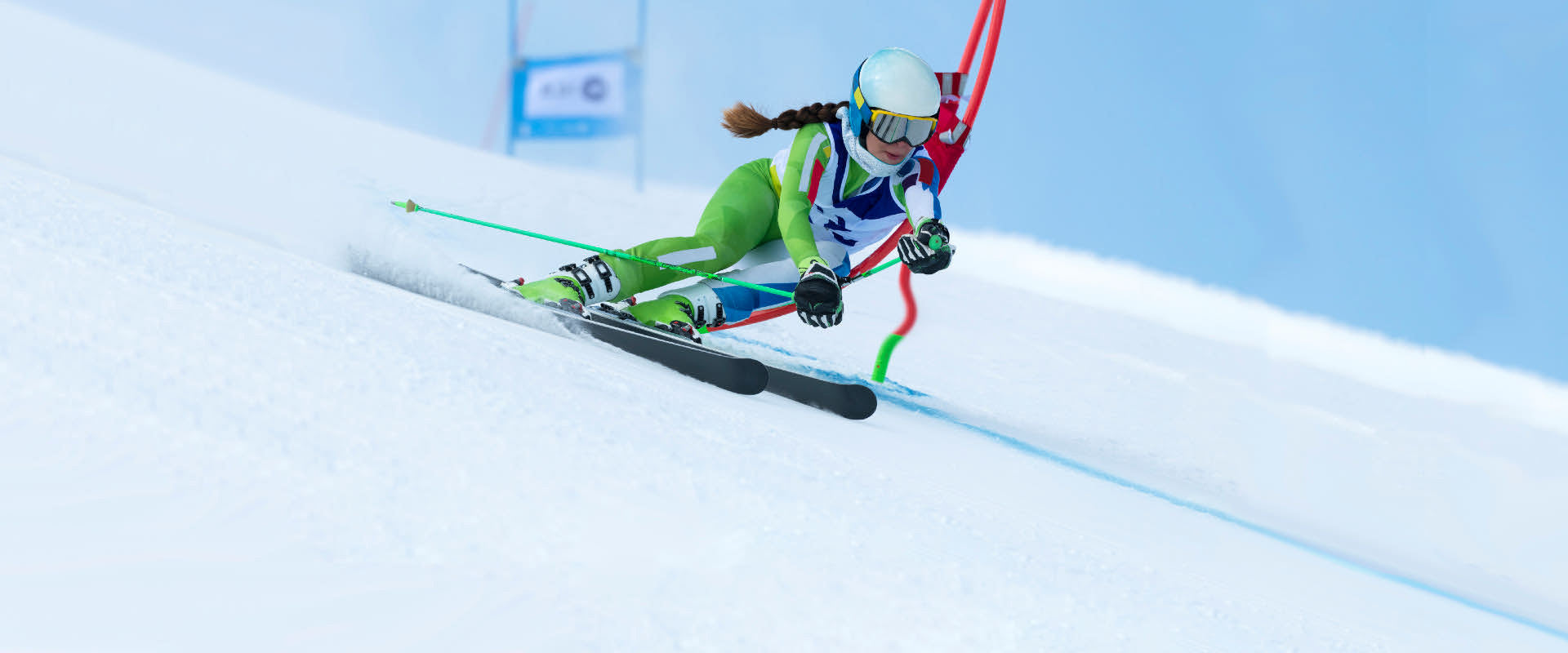 female slalom racer turning past gate